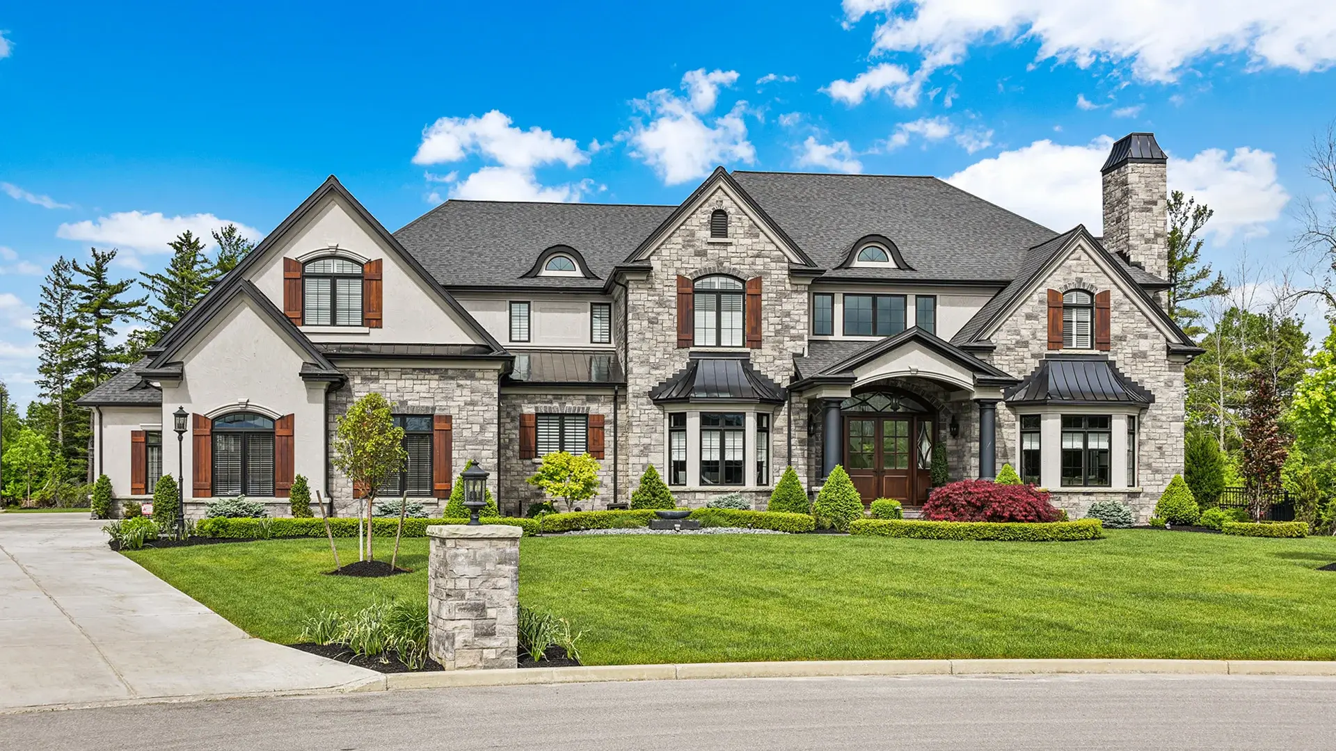 Luxury home exterior with professional landscaping - Buffalo real estate photography